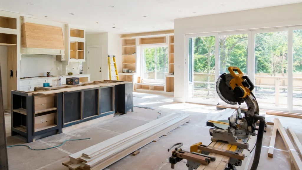 Contractors renovating a modern home interior during a whole home remodeling project in Beaverton, Oregon, featuring an open-concept kitchen, energy-efficient design, and indoor-outdoor living upgrades.