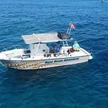 Guests enjoying a snorkeling tour with Kona Ocean Adventures in the clear waters of Hawaii's Big Island