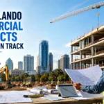 Orlando commercial construction project with a construction manager reviewing blueprints at an active building site