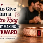 Couple sharing a romantic moment with a rose gold men's promise ring featuring a red gemstone, illustrating how to give a man a promise ring without making it awkward.