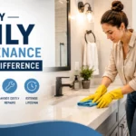 Modern bathroom with a homeowner performing daily maintenance by cleaning the sink, illustrating how regular care prevents damage, mold, and costly repairs.